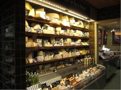 a store filled with lots of cheese on shelves