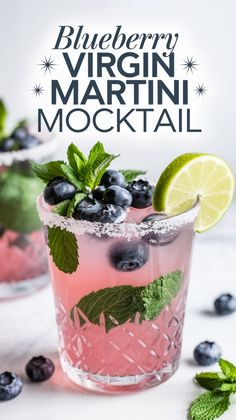 blueberry virgin martini mocko cocktail with lime and mint garnish on the rim