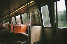 the inside of a train with lots of seats and windows on it's sides