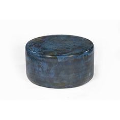 a round blue marble box sitting on top of a white surface with the lid open