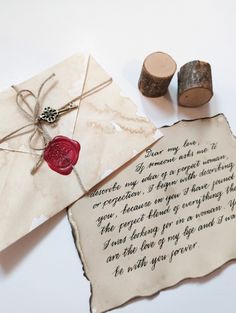 a piece of paper with writing on it next to two corks and a rubber stamp