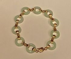 Vintage 14k gold and jade link bracelet. hallmarked 14k and designers mark and China on the lock. It has been additional tested to be 14k gold. Very nice light green colour Jade rings, which makes it look very delicate and pretty. Length is 18cm. Width of the jade rings are 1.4cm. Will be sent by registered and insured delivery free of charge. Should you wish to reach you very quickly, please let me know, and for a small charge, I can send it by DHL Express. It will be send in a luxury jewellers Luxury Jade Bracelets, 14k Gold Bangle Bracelet, Halo Bracelet, Jade Jewellery, Jade Rings, 22k Gold Ring, Lock It, Double Bass, Jade Ring