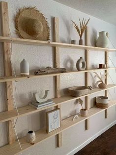 some shelves with vases and other items on them