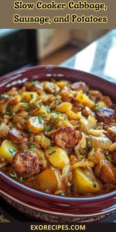 slow cooker cabbage sausage and potatoes in a red bowl with text overlay that reads slow cooker cabbage sausage and potatoes