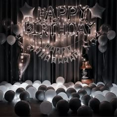 a birthday party with balloons and lights