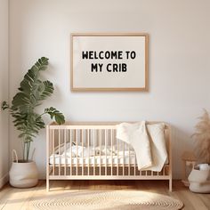 a baby's crib with a welcome sign above it