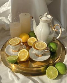 tea set with lemons and limes on a tray