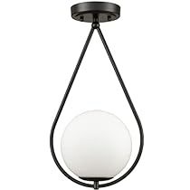 a black and white light fixture with a glass ball hanging from it's side