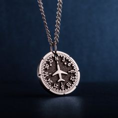 "Airplane Heading Indicator Necklace. Introducing our personalized round unisex pendant - a unique and thoughtful gift for Cabin crew, Flight attendants, adventure and travel lovers. The pendant features a captivating image of a Heading Indicator and aircraft. The Heading Indicator represents direction and guidance, reminding the wearer to follow their path and stay true to themselves. Crafted with high-quality jewelry stainless steel, this pendant is not only stylish, but also durable - suitable for pilot, aviation enthusiasts, commuters, adventures, backpackers, and anyone who loves the great travel. The personalized round pendant is a men's necklace that makes a perfect gift for dad, husband, or guy, whether for Father's Day, his birthday, or any other special occasion. A pendant with n Compass Design Pendant Jewelry Gift, Compass Design Pendant Jewelry As Gift, Compass Design Pendant Necklace As Gift, Compass Design Pendant Charm Necklace As Gift, Minimalist Compass Design Jewelry As Gift, Compass Design Medallion Jewelry As Gift, Personalized Round Pendant Necklace Souvenir, Personalized Round Pendant Necklace As Souvenir, Adjustable Compass Design Necklace For Gift