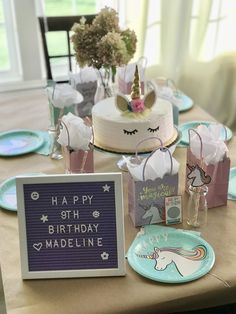 a birthday cake and other decorations on a table