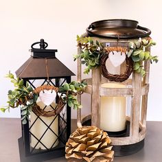 two candles sitting next to each other on a table