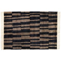 a black and beige rug with stripes on it, in the shape of rectangles