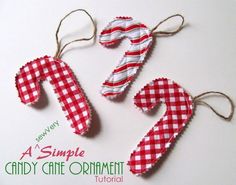 three candy cane ornaments hanging from twine on a white background with the words, a simple candy cane ornament