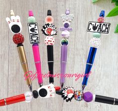 several different types of pens on a table