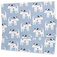 two blue and white dog napkins with dogs on them