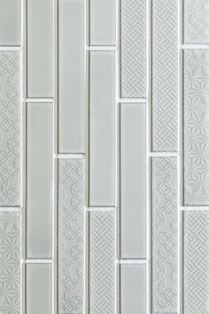 a white tile wall that is made up of small squares