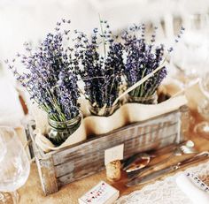 lavenders are in mason jars on a table