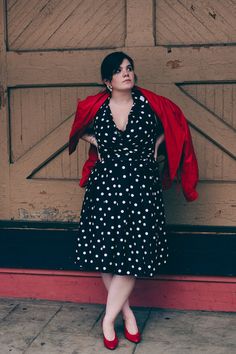 HIGHLIGHTS: * Vintage Plus Size 14 Dress! * Black with White Polka Dots * Great Transitional Late Summer / Early Fall * Great Condition! As shown with a red leather jacket (now included) this is a fantastic and versatile faux silk dress with a gorgeous swing skirt and little sheen to it.  Black and white polka dots throughout.  Faux wrap top with cute notched collar and fitted waist.  Long matching fabric belt.  4" Box pleats at the waist lead to the spectacular 104" sweep of the skirt.  Long hidden side zipper with metal pull. Lined upper.  Skirt is unlined however the back of the fabric has a silvery sheen that is very eye-catching.  Wear from work to wedding/ day to night! (Shoes, jacket, accessories not included). RN70643.  Maker: Jessica Howard Origin: Made in Indonesia Era: 1980s/ear Black And White Polka Dot Dress Outfit, White Polka Dot Dress Outfit, Black And White Polka Dot Skirt, Long Outfit, Jessica Howard, Mid Size Fashion, Dot Dress, Polka Dot Dress, Swing Dress