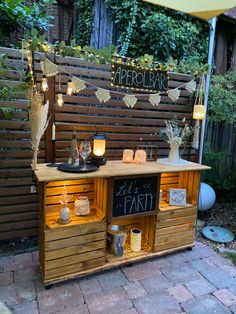 an outdoor bar with candles and decorations on it