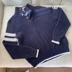 Tommy Hilfiger knit sweater navy blue quarter zip with white stripe sleeve detail perfect preppy basic for summer nights...Measures 20 inches pit to pit, 26 inches length. Model is 32D/26 waist/5ft Navy Polo Sweater With Ribbed Collar For Winter, Navy Long Sleeve Polo Sweater, Winter Sweater With Striped Collar And Crew Neck, Winter Crew Neck Sweater With Striped Collar, Navy Long Sleeve Polo Sweater For Winter, Fall Cotton Polo Sweater With Striped Collar, Navy Half-zip Casual Sweatshirt, Casual Long Sleeve Polo Sweater With Striped Collar, Casual Long-sleeve Polo Sweater With Striped Collar