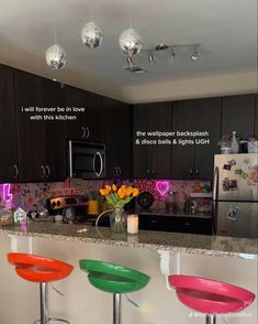 three colorful stools sit in front of a kitchen counter with flowers on it and the words, what do you think about this kitchen?