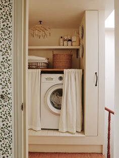 a washer and dryer in a small room