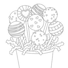 a flower pot filled with lots of cookies and lollipops on top of it