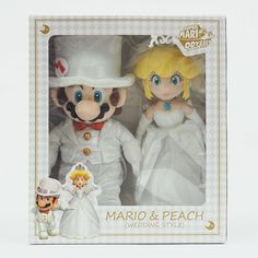 the mario and peach wedding set is in its box with it's bride and groom figurines