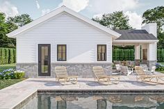 a small white house sitting next to a pool with lawn chairs on the patio area