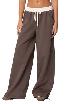 Cozy and cool, these sweatpants feature a relaxed, slouchy fit with wide legs, a contrasting low-rise waist and a soft cotton-blend fabrication that'll keep you ultracomfy. Elastic/drawstring waist Front scoop pockets 50% cotton, 50% polyester Machine wash, dry flat Imported Brandy Wide Leg Sweatpants, Cute Sweat Pants, Desired Wardrobe, Low Rise Sweatpants, Brown Flare Pants, Cute Sweats, College Wardrobe, Comfy Sweats, Comfy Sweatpants