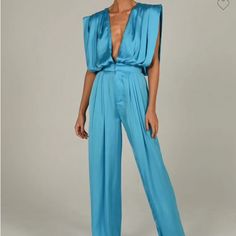 Size Small Blue Satin Chic Blue V-neck Pantsuit, Chic Light Blue V-neck Jumpsuit, Light Blue V-neck Jumpsuit For Party, Blue Summer Pantsuit For Party, Blue Pantsuit For Summer Party, Light Blue Fitted V-neck Jumpsuits And Rompers, Fitted Light Blue V-neck Jumpsuits And Rompers, Chic Blue Jumpsuits And Rompers For Evening, Blue Bottoms For Summer Evenings