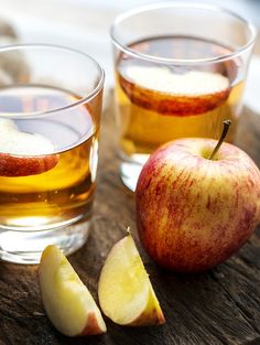 an apple cider vinegar benefits in glasses with apples on the side and text overlay that reads, apple cider vinegar benefits