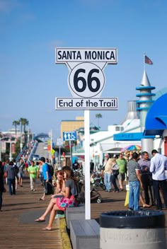 people are walking around at the santa monica 66 end of the trail