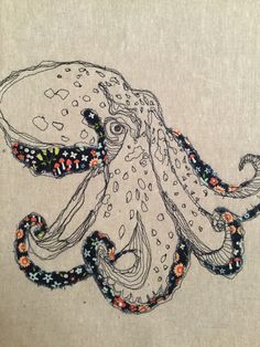 an octopus is shown in this embroidery pattern on a piece of fabric, which has been stitched together