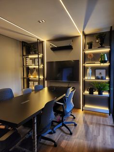 an empty conference room is lit up by recessed lighting and built - in shelving