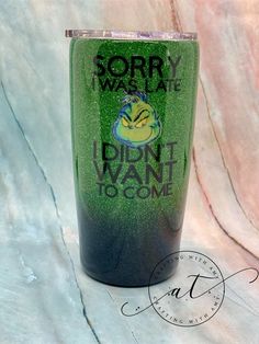 a green and black tumbler cup with the words sorry we are, i didn't want to come