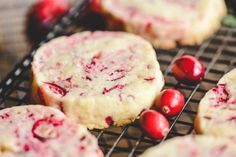 cranberry shortbreads cooling on a wire rack with fresh cranberries