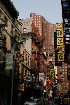 a city street filled with lots of tall buildings