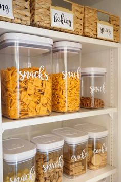 the pantry shelves are filled with different types of snacks and snacks in plastic bins