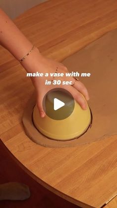 a person is pressing the button on a wooden table with text that reads, make a vase with me in 30 seconds