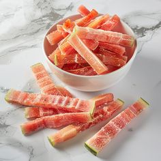 sliced up watermelon in a bowl on a marble counter