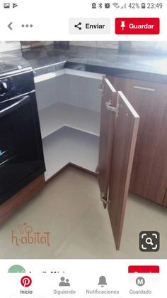 a kitchen with an oven and dishwasher in the corner, next to cupboards