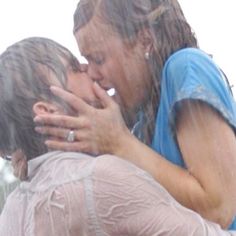 two people in the rain hugging each other