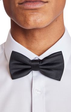 An updated version of the classic bowtie, the Bradley Bowtie in Satin Black makes an excellent addition to any formal outfit. The bowtie is pre-tied and adjustable, making it the perfect combination of convenience and elegance. PRODUCT DETAILS: style 6595B pre-tied bow tie adjustable band t-hook-to-fabric closure 100% polyester imported Fall Suit, Formal Pants, Pre Tied Bow Tie, Bag Icon, Formal Outfit, Fall Shopping, Black Satin, Casual Jacket, Modern Fit