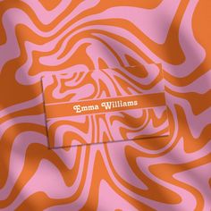 an orange and pink zebra print wallpaper with the name emma williams on it's side