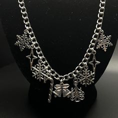 Winter themed necklace
✨✨✨
Can be worn long or as a choker! 
Has jump rings and a lobster claw clasp for adjustability 
Features 9 charms 
Including : 
1 pair of Christmas bells ornament
1 candy cane
1 yuletide tree 
4 snowflakes 
2 star sparkles 
Stainless steel & Silver color metal hardware (metal alloy) 
🫶🏻🫶🏻🫶🏻
US only
About 18.5 inches long 
Great condition 
Handmade
Message me for 15% off of bundles
🖤🖤🖤









#Charms pendants beads #chain links #choker yule #winter autumn fall cold xmas holiday gift present casual streetwear #snowflake costume cosplay fae fairy cottagecore coquette whimsy Snowflake Costume, Fairy Cottagecore, Cottagecore Coquette, Bell Ornaments, Beads Chain, Chain Links, Winter Themed, Xmas Holidays, Costume Cosplay