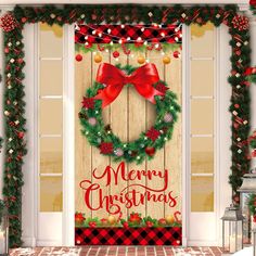 a merry christmas door cover with a wreath and red bow