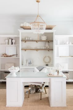 a white desk and shelves in a room