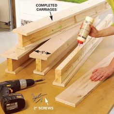 How to DIY a Ceiling Garage Storage System | The Family Handyman Sliding Storage, Garage Ceiling, Overhead Garage Storage, Overhead Garage, Garage Storage Systems, Bin Storage, The Family Handyman, Overhead Storage, Diy Garage Storage