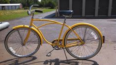 a yellow bicycle parked in front of a building